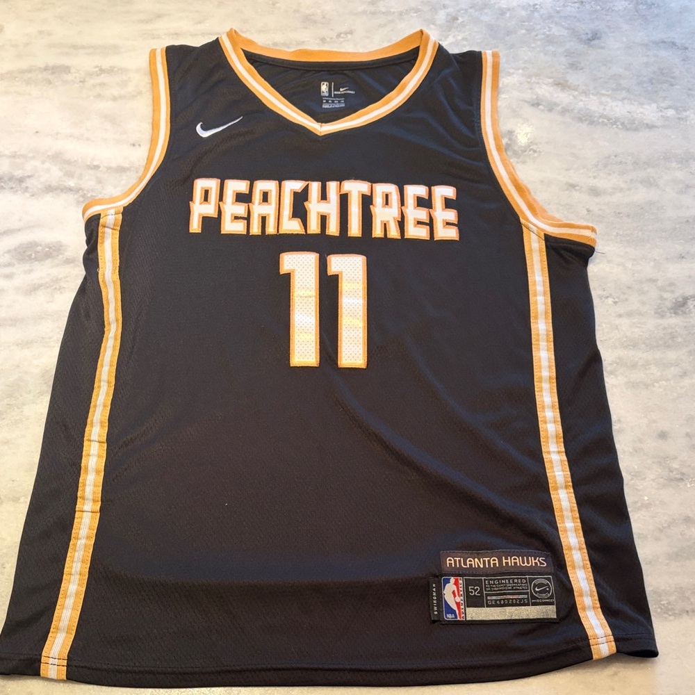 Nike Black and Gold Peachtree Trae Young jersey.